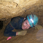 Picture of Matt Rosefsky leading a caving / spelunking expedition in a wild cave